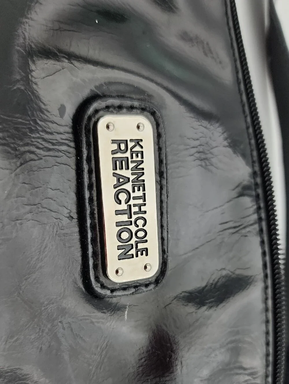 Kenneth Cole Reaction sleek patent